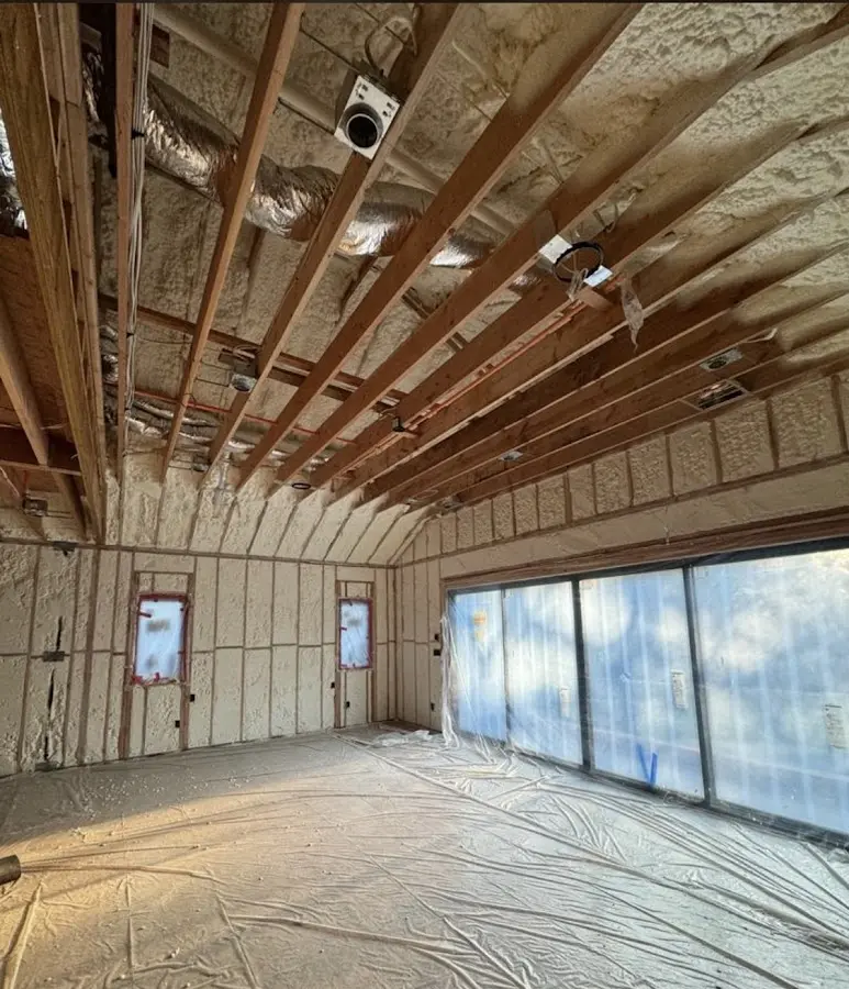 Interior walls and ceiling insulated with spray foam during new construction in Conemaugh